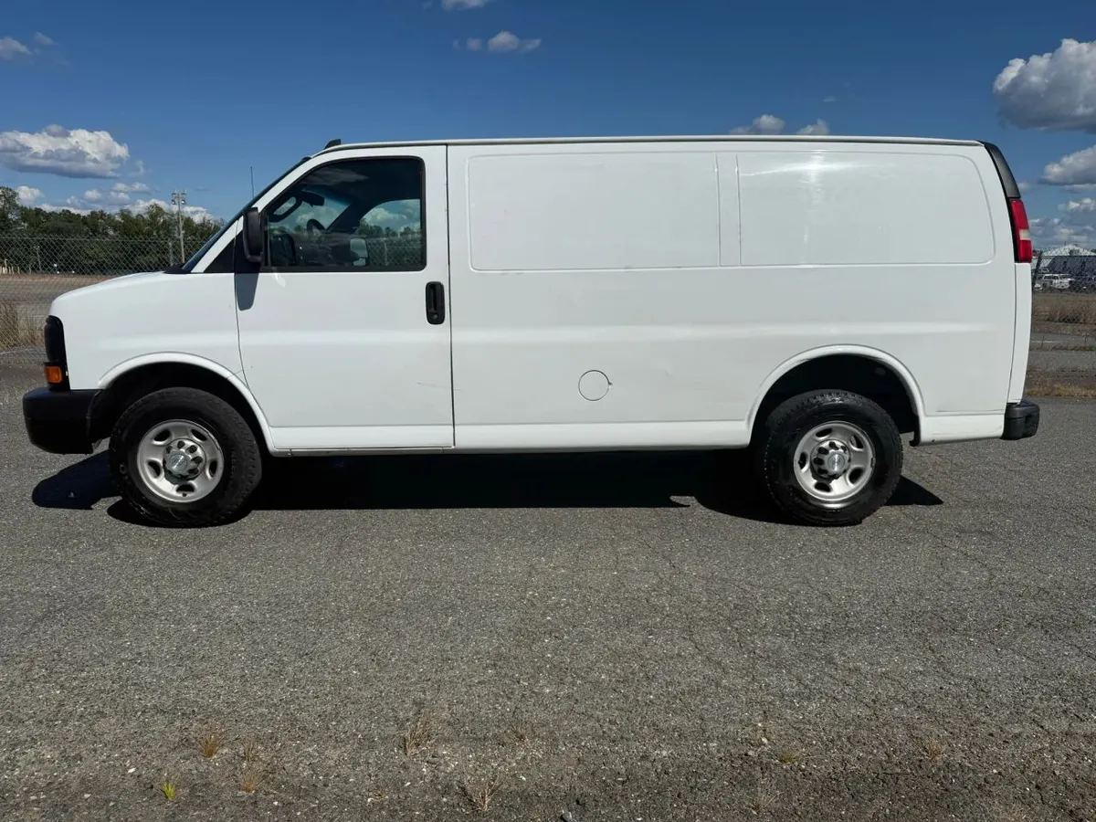 Side profile of a white Chevrolet Express cargo van